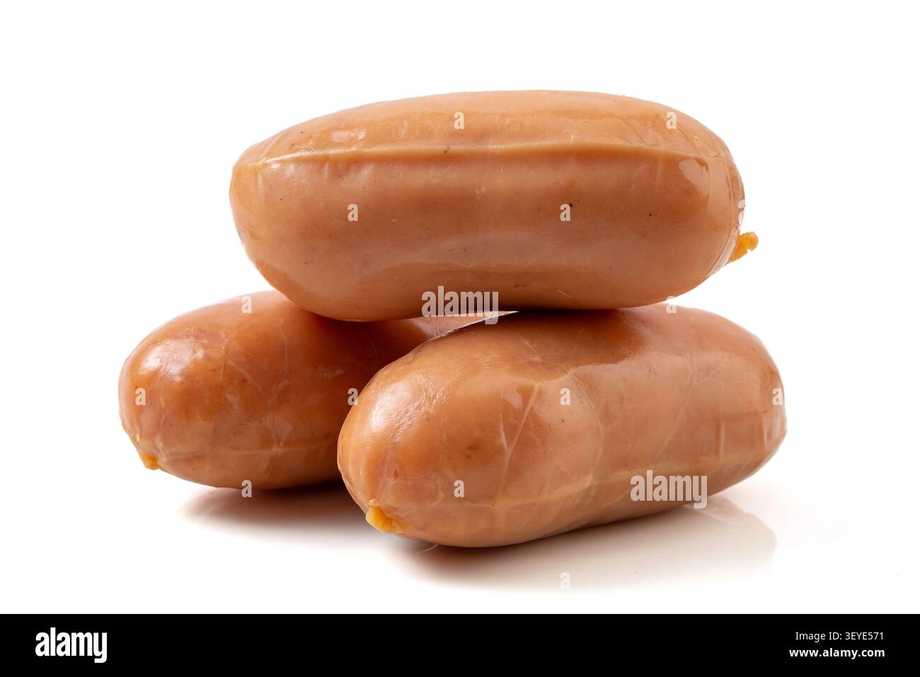 Three mini pork sausages stacked on white background Stock Photo