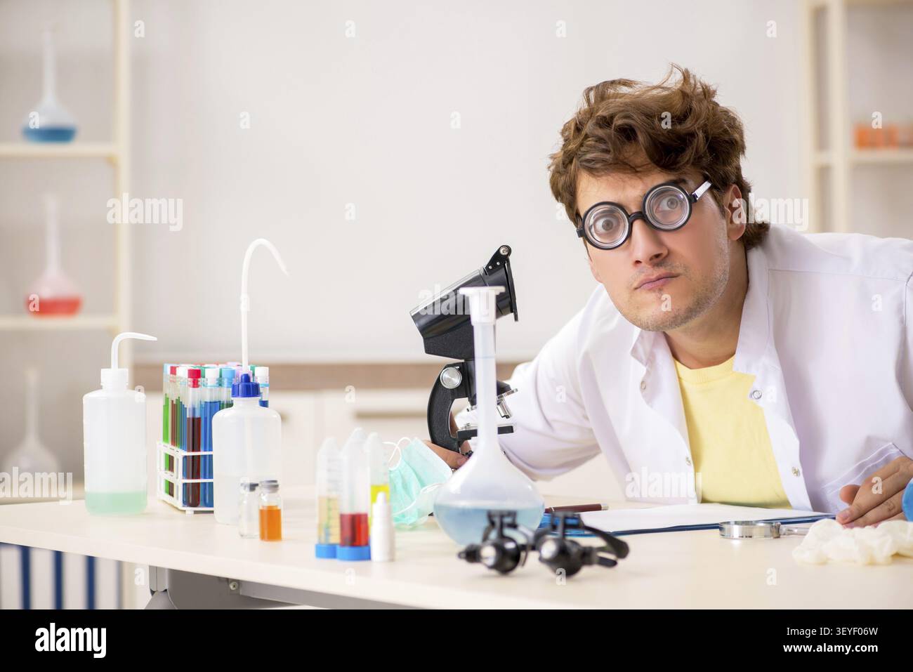 Funny crazy chemist doing experiments and tests Stock Photo