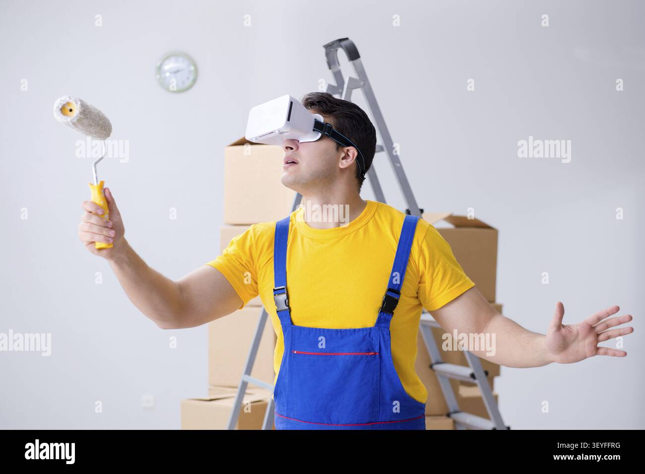 Painter contractor working with virtual reality goggles Stock Photo