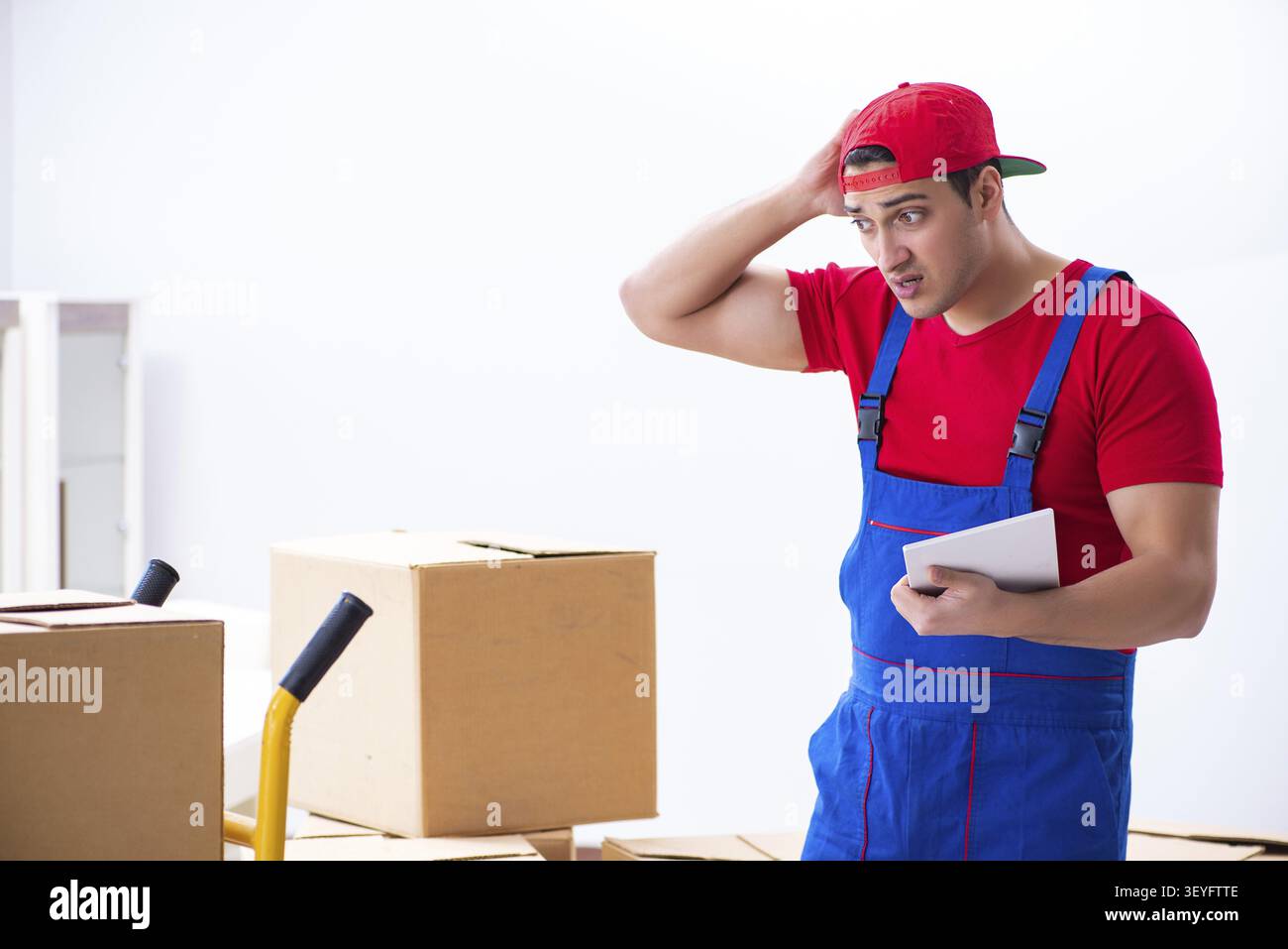 Contractor worker moving boxes during office move Stock Photo