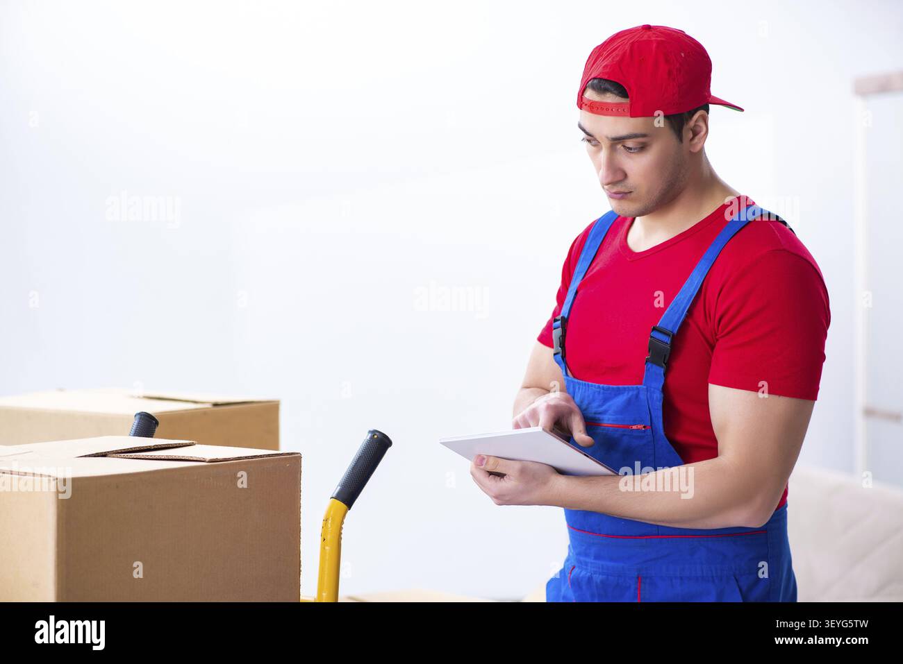 Contractor worker moving boxes during office move Stock Photo
