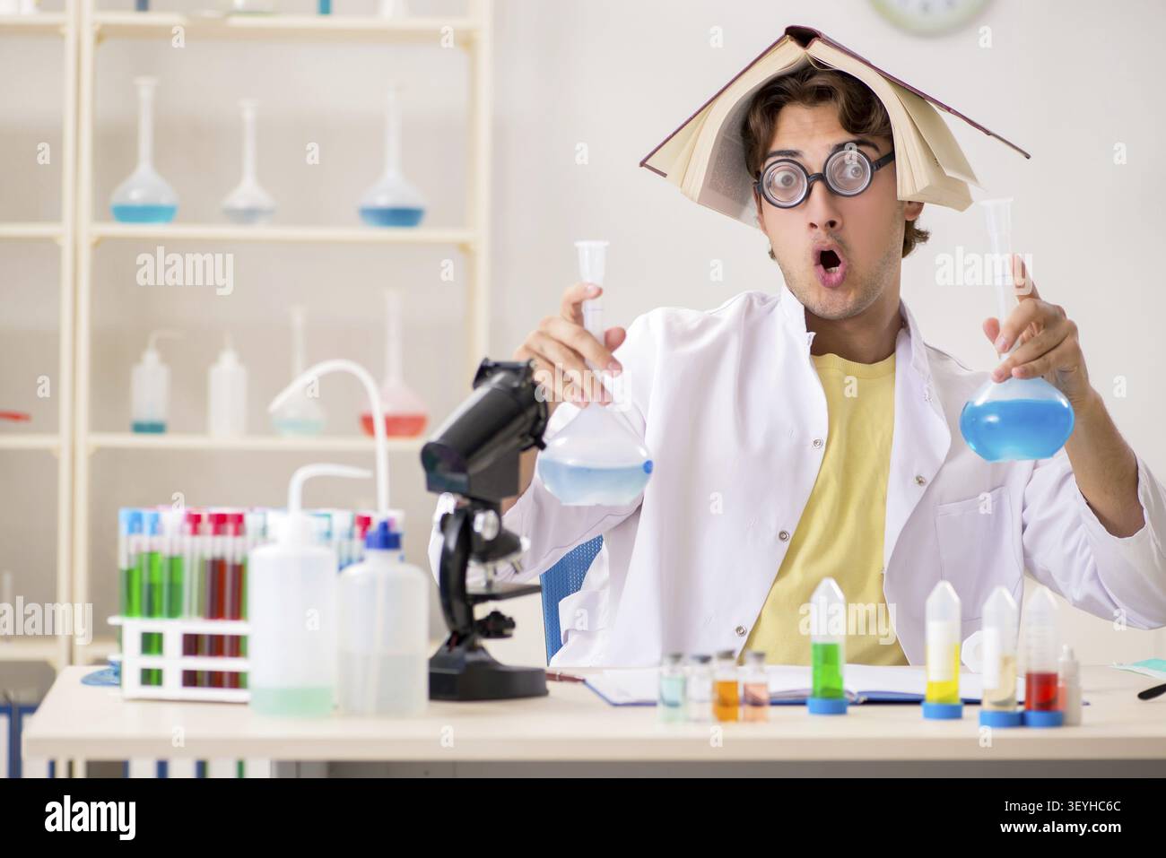 Funny crazy chemist doing experiments and tests Stock Photo