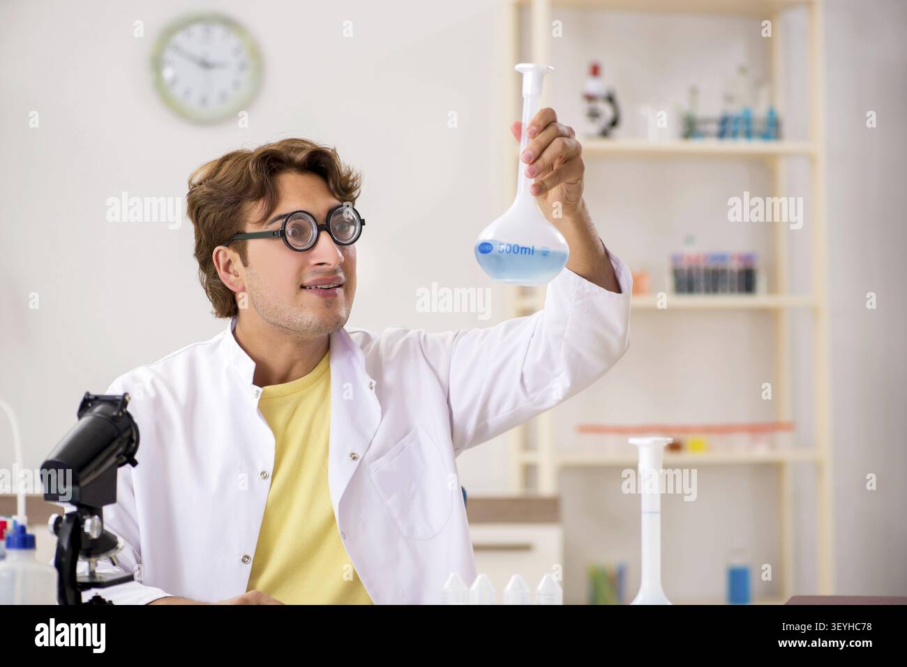 Funny crazy chemist doing experiments and tests Stock Photo