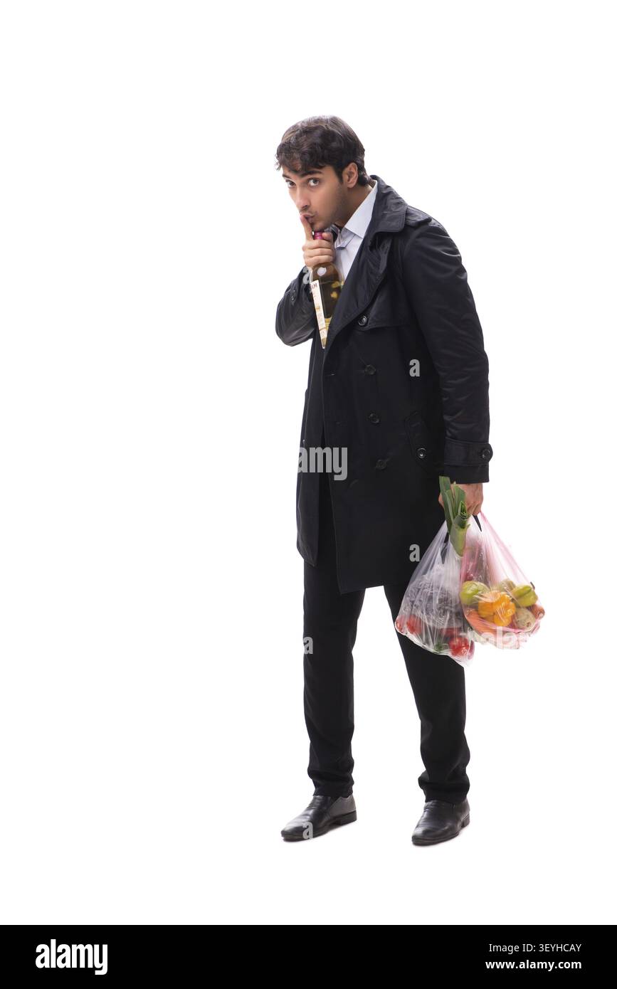 Young handsome man with vegatables in shopping concept Stock Photo