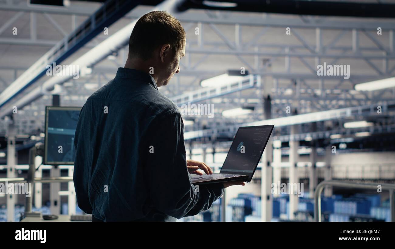 Data center engineer reviews artificial intelligence systems and machine learning processes inside a data center. Stock Photo