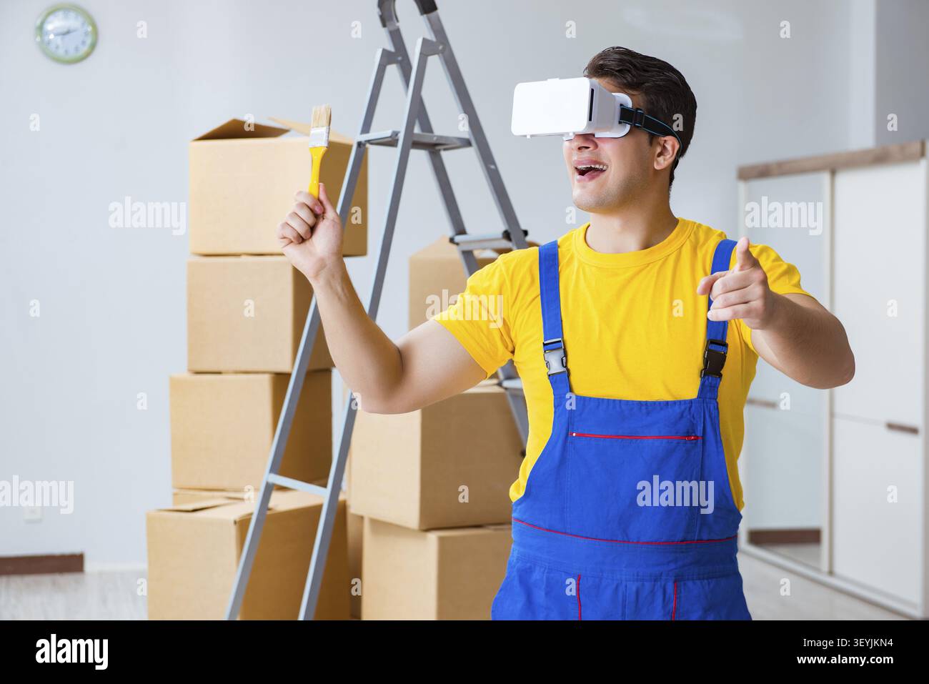 Painter contractor working with virtual reality goggles Stock Photo