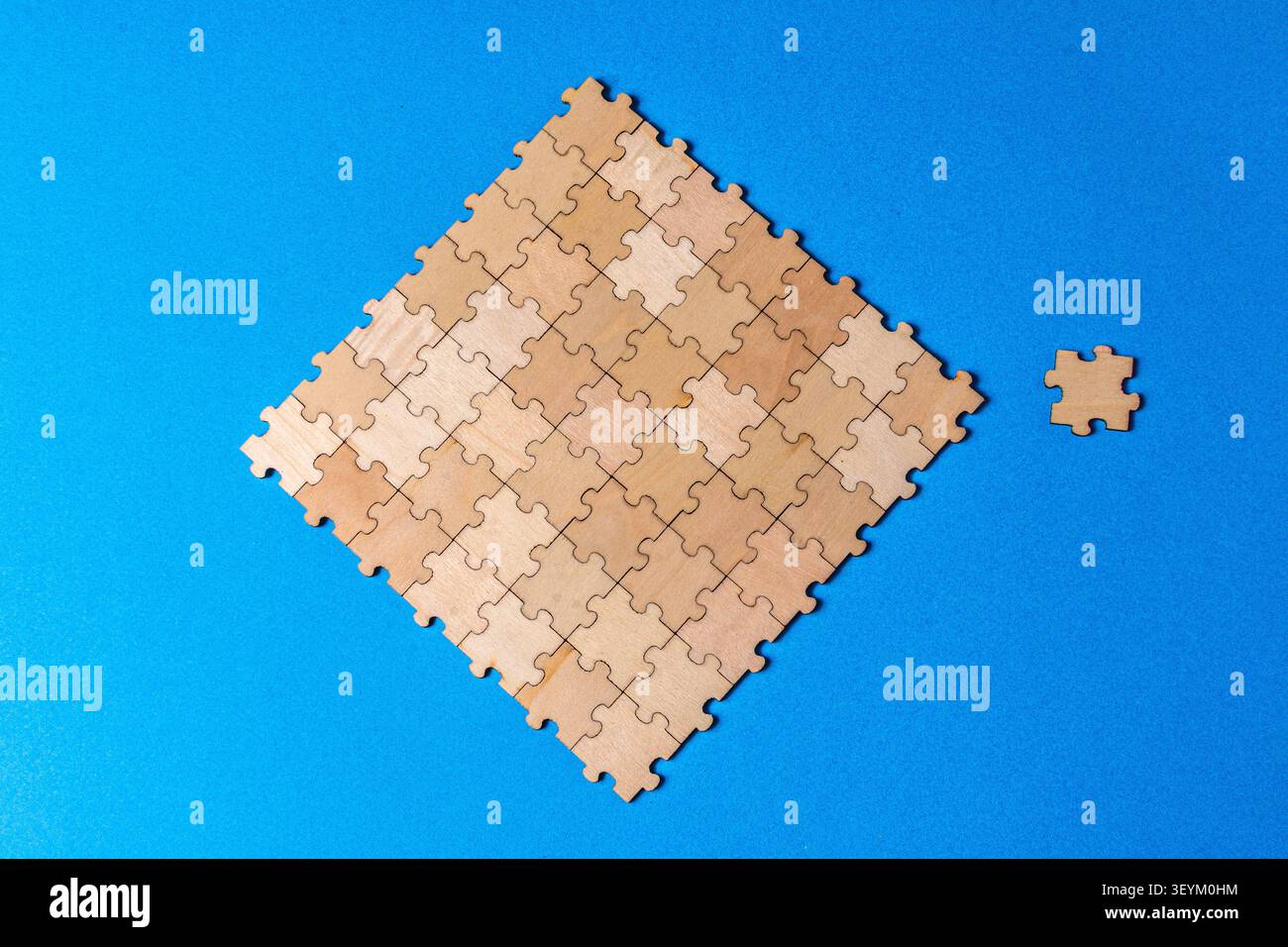 Puzzle pieces forming a cohesive unit with missing element Stock Photo
