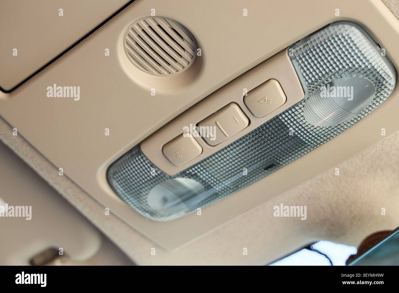 Car interior ceiling light and speaker panel Stock Photo