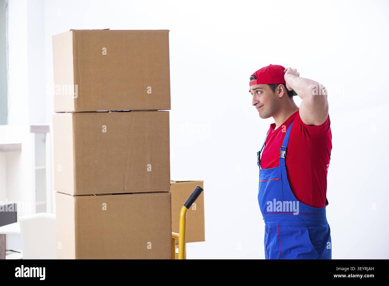 Contractor worker moving boxes during office move Stock Photo