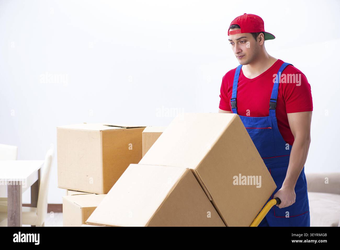 Contractor worker moving boxes during office move Stock Photo