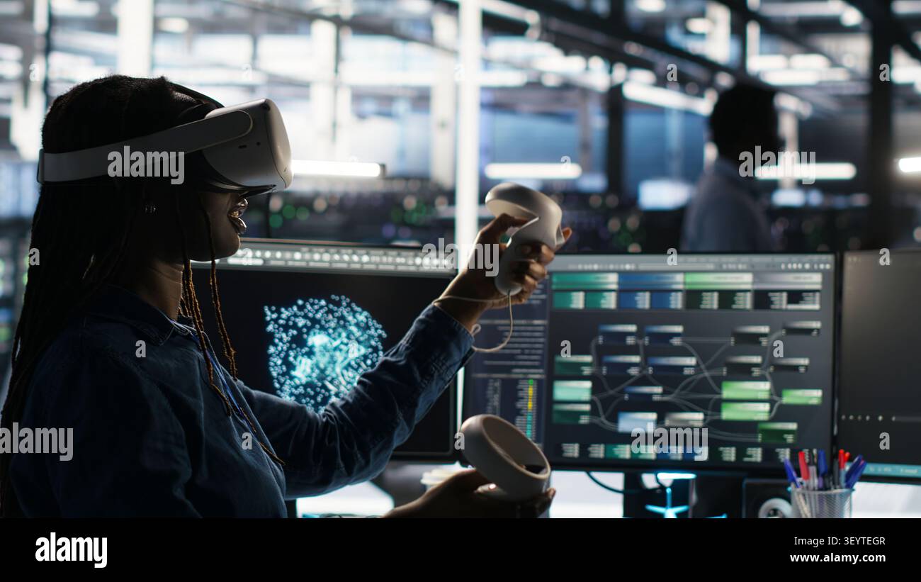 Data center engineer uses virtual reality and node tree software to analyze datasets and system performance. Stock Photo