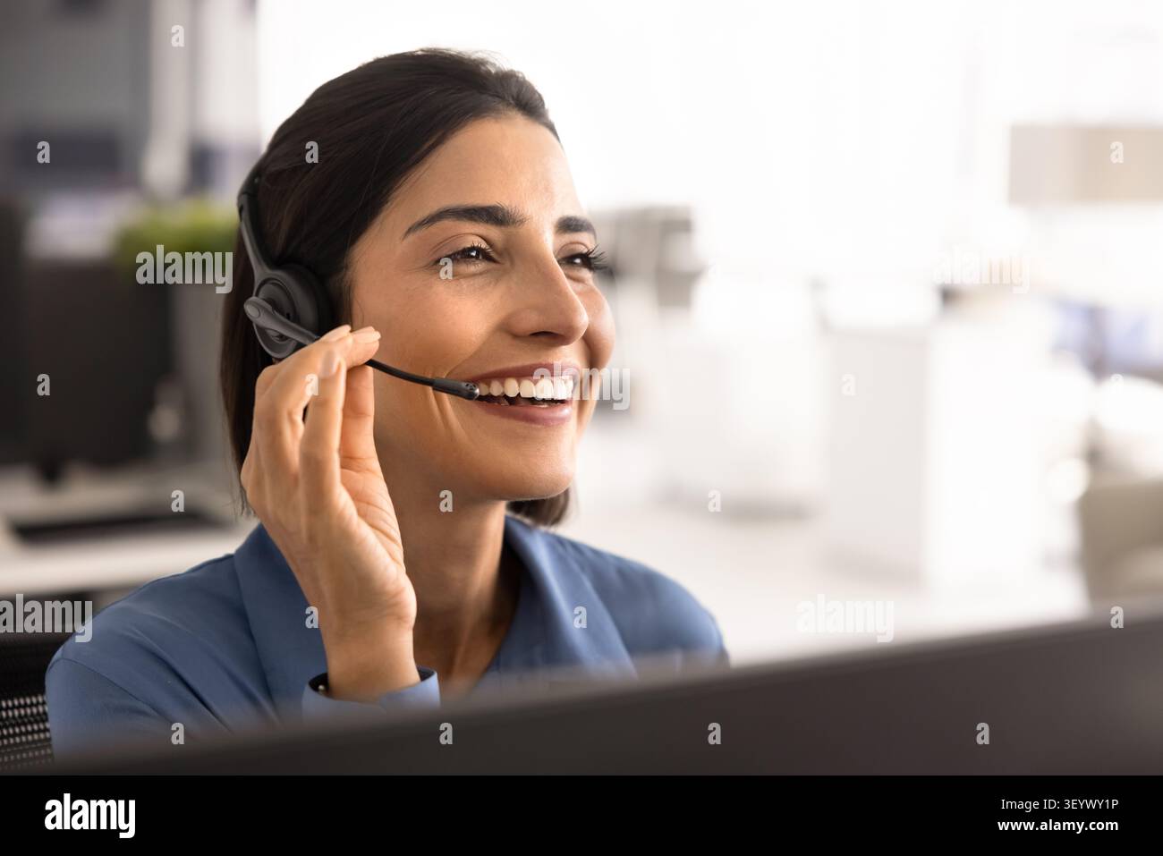 Portrait of call center, customer support services worker Stock Photo