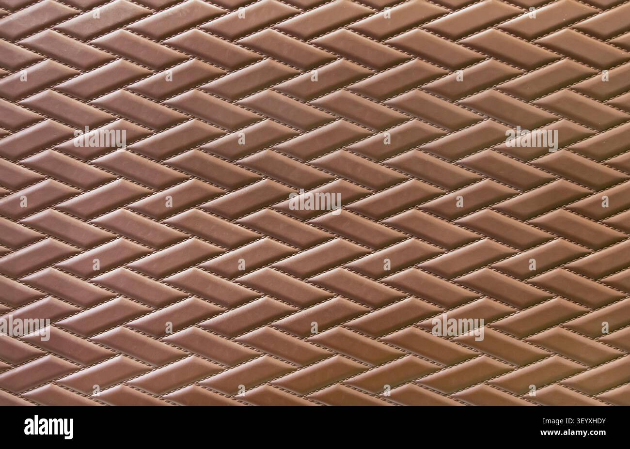 brown leather background and texture as a pattern for the interior car or a sofa or wall covering Stock Photo