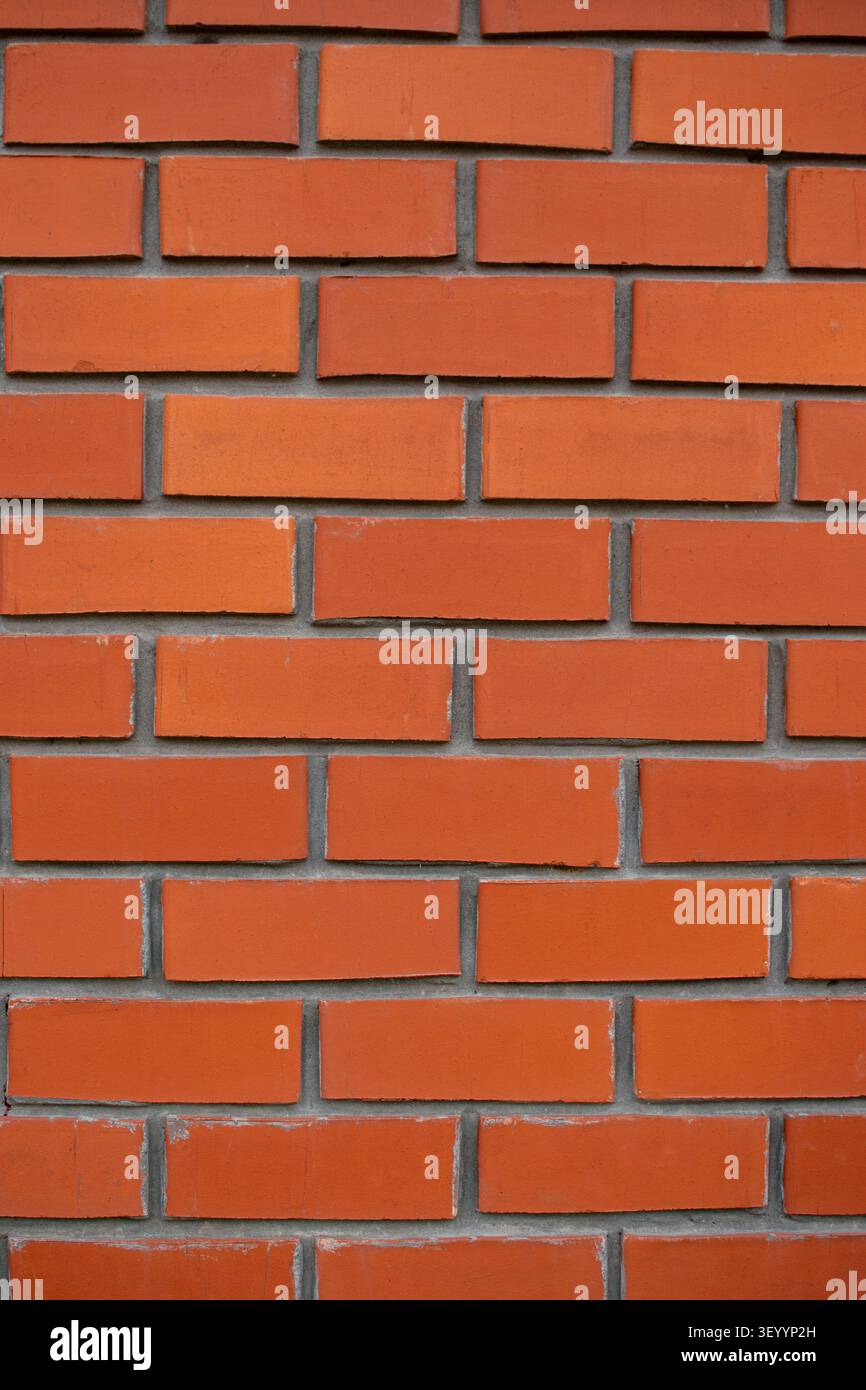 Clean new red brick wall vertical texture backdrop Stock Photo