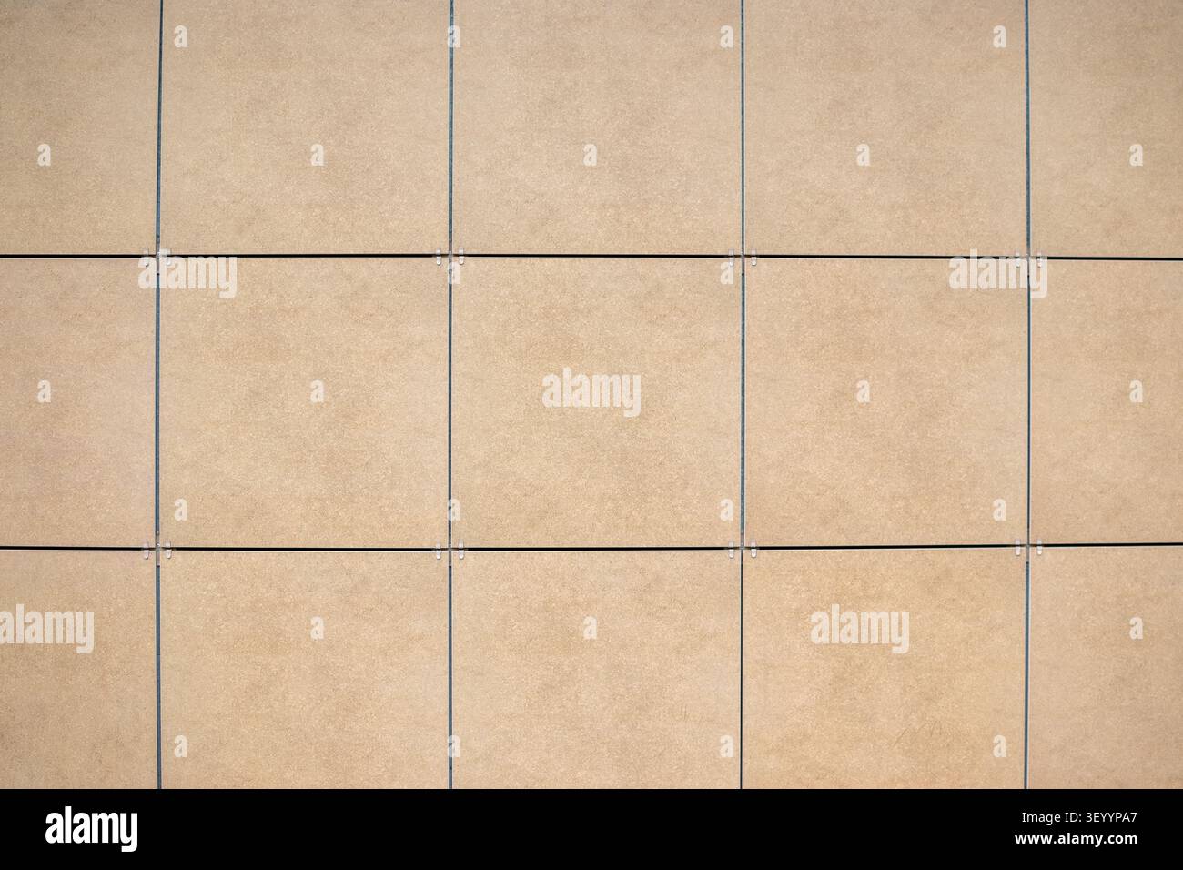 Beige square ceramic tile wall texture background Stock Photo