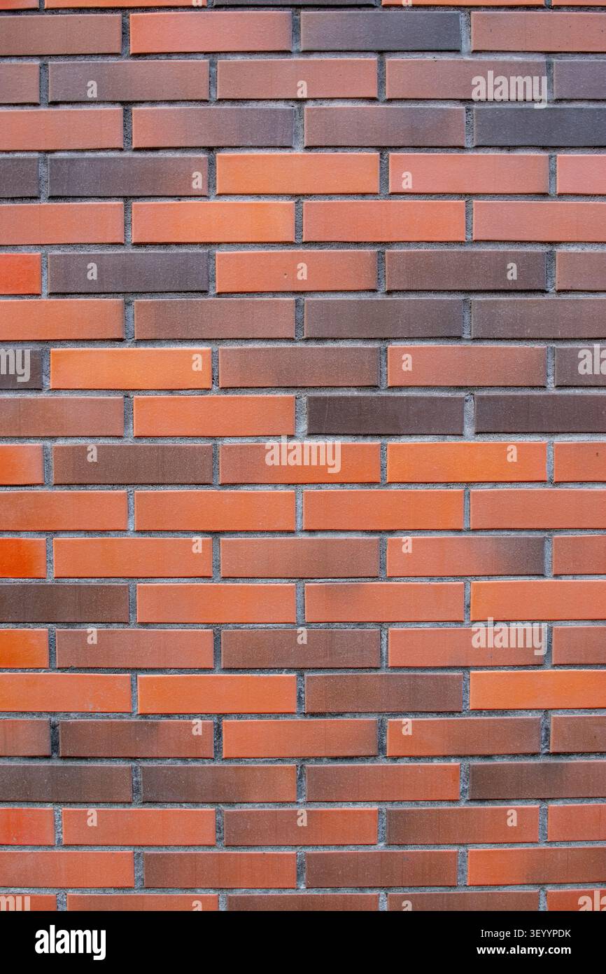 Modern smooth red and brown clinker brick wall vertical texture Stock Photo