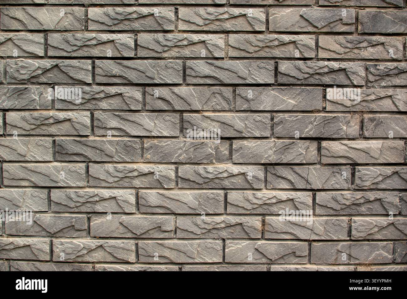 Grey decorative stacked stone wall horizontal texture Stock Photo
