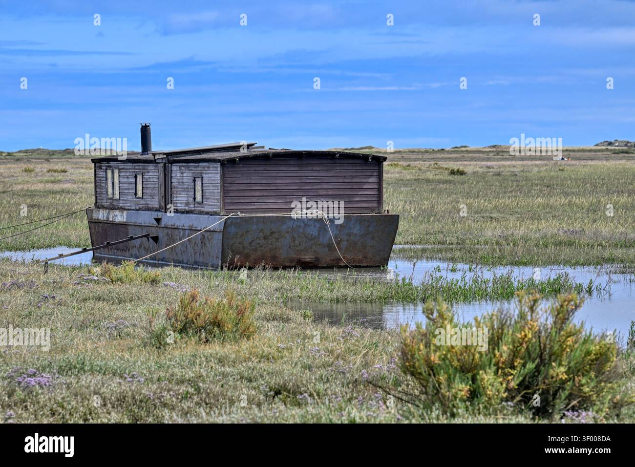 Old houseboat on the marshes at Burnham Deepdale near Brancaster, Norfolk, UK Stock Photo