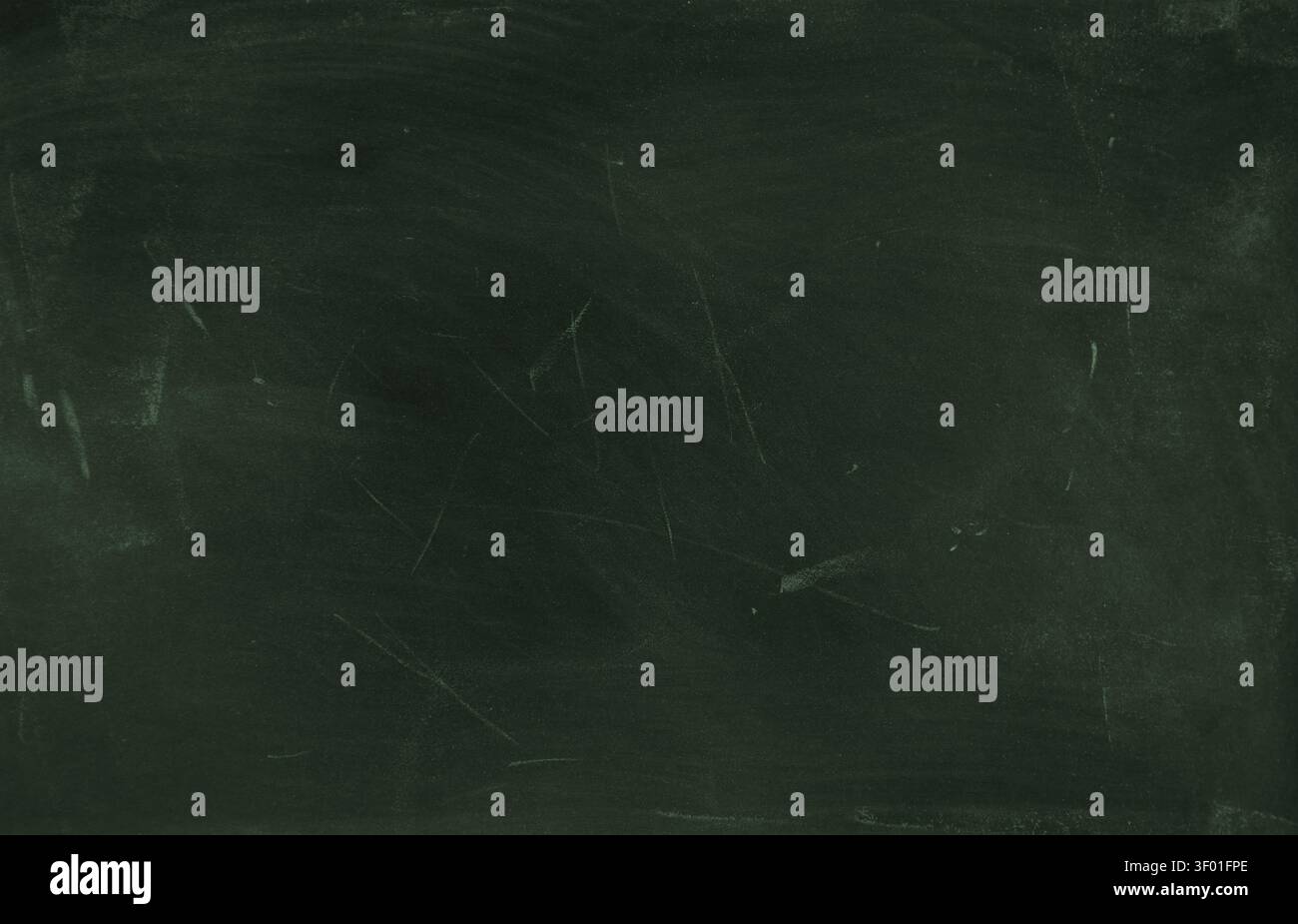 Chalk rubbed out on green chalkboard background Stock Photo