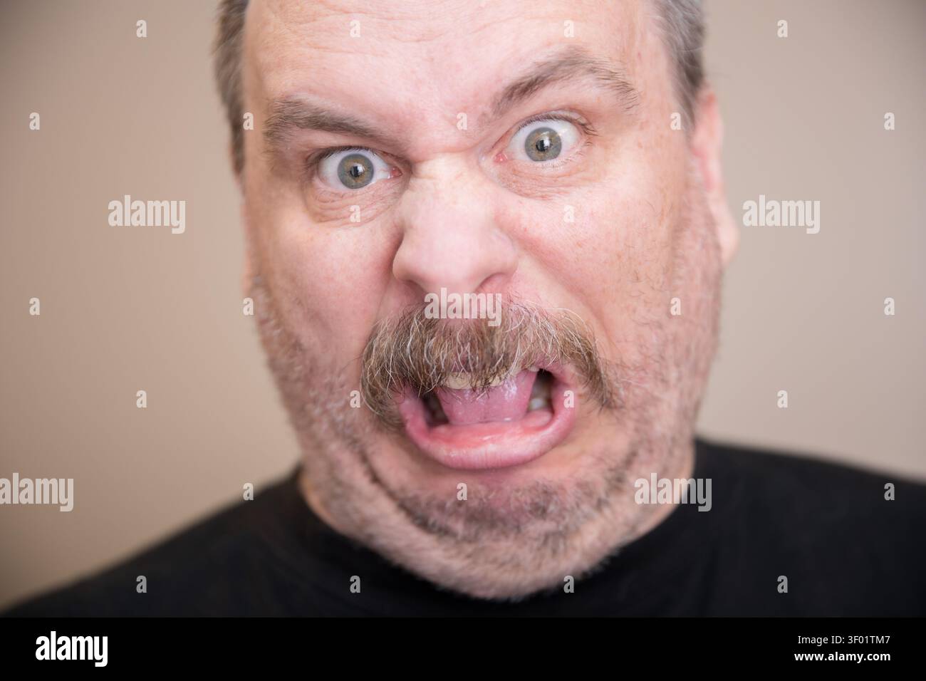Man with a shocked expression Stock Photo