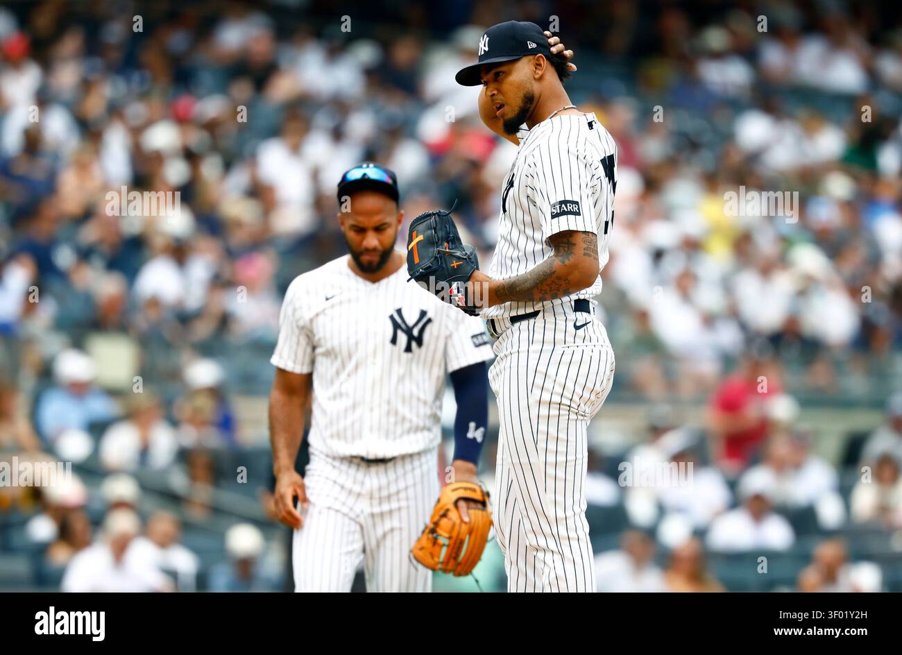 New York Yankees pitcher Camilo Doval, right, reacts after giving up ...