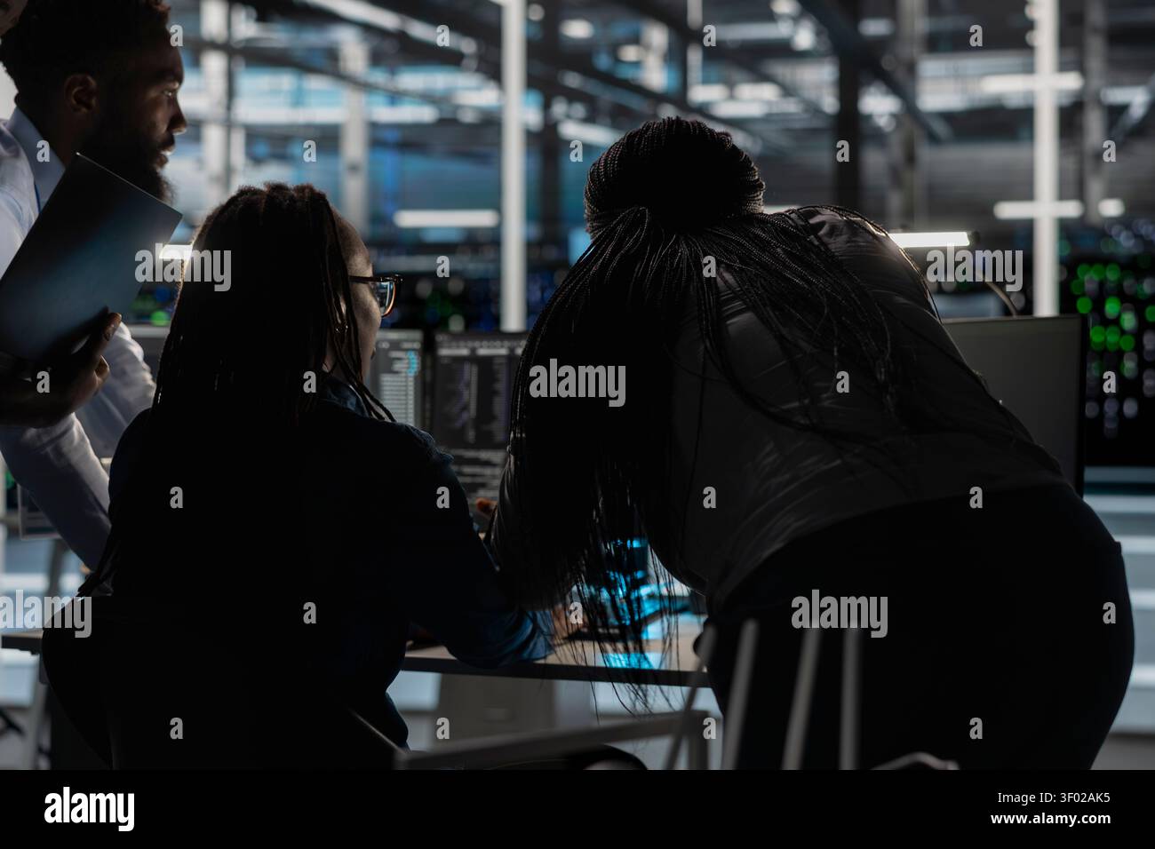 Data center engineering team deploy data backup solutions, managing server storage and supporting reliable recovery. Stock Photo