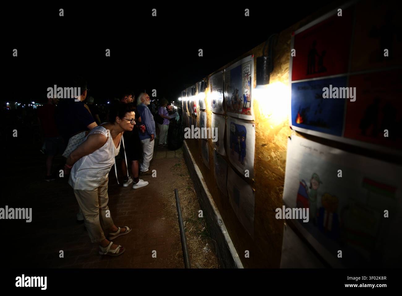 Athens, Greece. Jul  05, 2026. Athens Anti-Racist Festival 2026. A visitor views political cartoons at the exhibition of the Festival. Credits: Harris Xanthopoulos | Alamy Live News Stock Photo