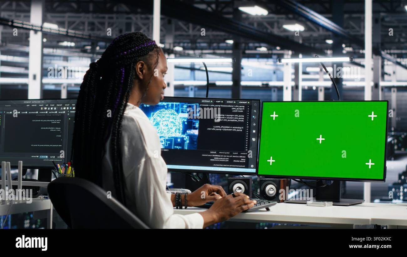 IT colleagues collaborate in a data center while reviewing AI diagnostics and infrastructure performance. Stock Photo