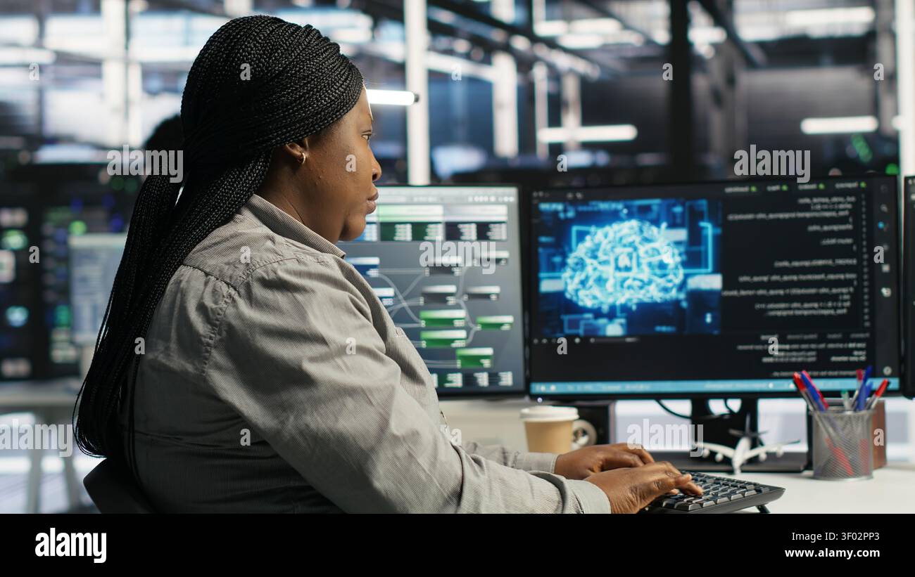 Server facility staff member rolling out AI solutions optimizing equipment. Server environment software engineer applying AI technology minimizing infrastructure downtime. Stock Photo