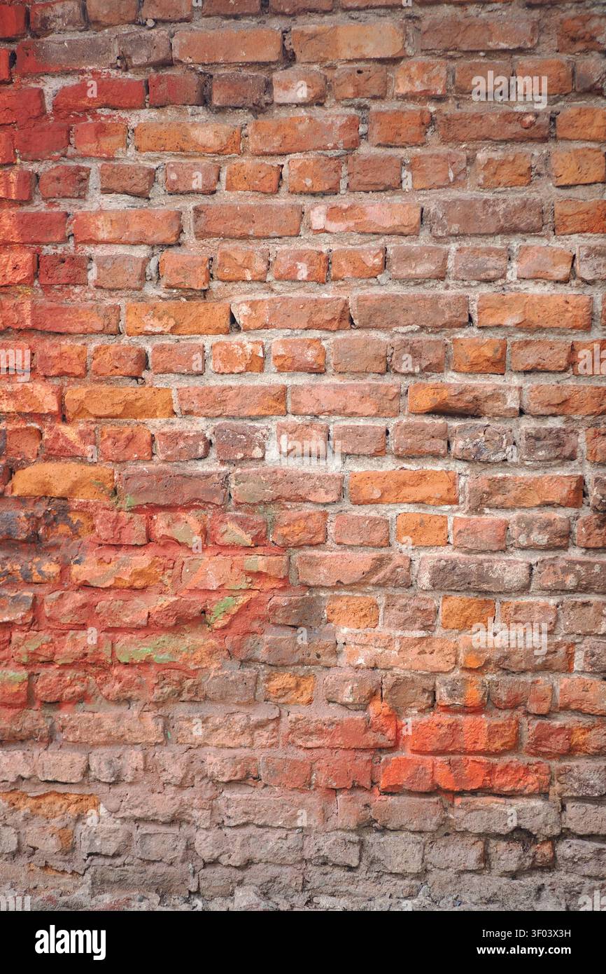 Old brick wall with different shades and textures visible Stock Photo