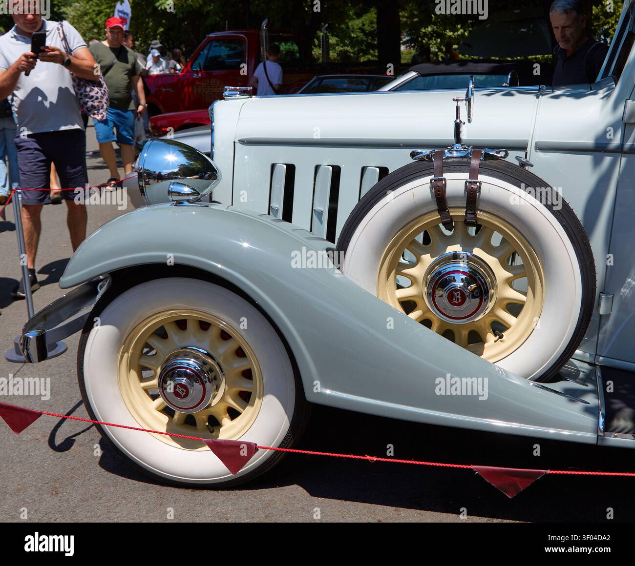 Burgas, Bulgaria - July 04, 2026: 1933 Buick 2-Door Victoria featuring whitewall tires showcased at a vintage car parade with spectators in the backgr Stock Photo