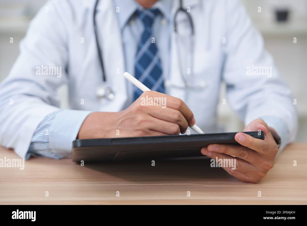 Healthcare Professional Using Digital Tablet for Medical Documen Stock Photo