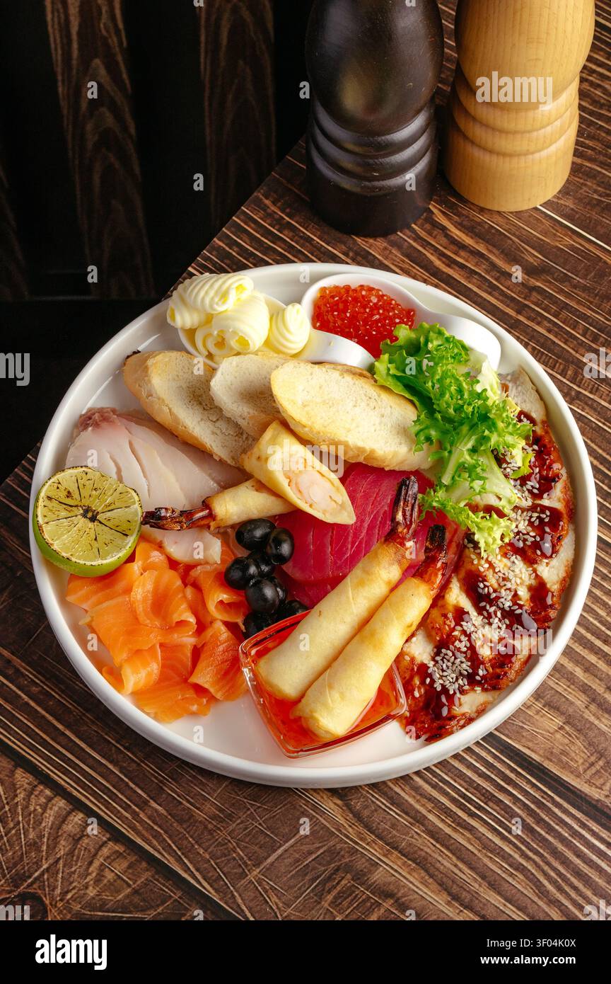 Gourmet assorted seafood appetizer platter on a table Stock Photo
