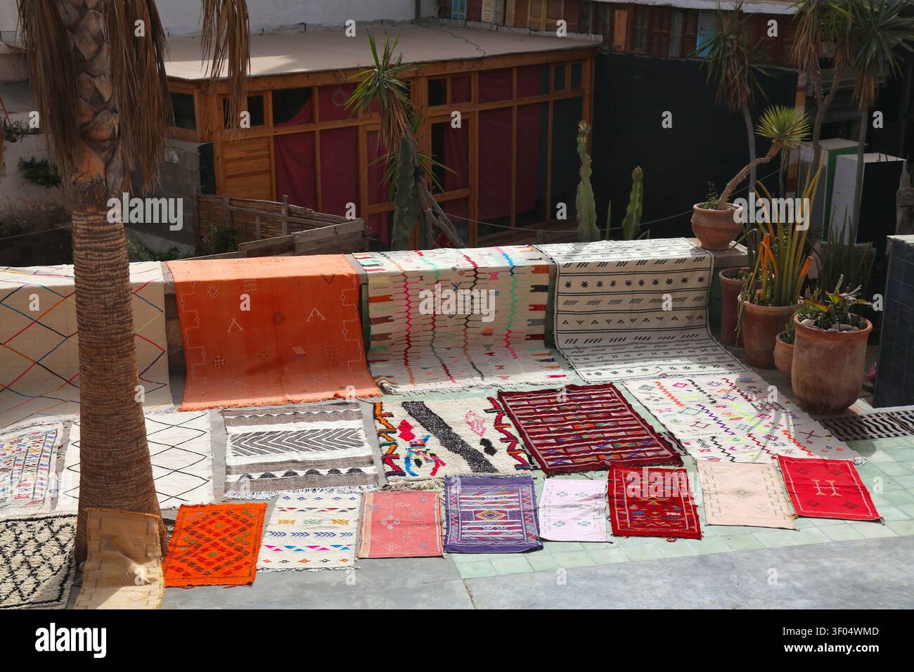 Moroccan carpet. Traditional wool carpets from a street vendor in a souk in Taghazout. Morocco handicraft. Stock Photo