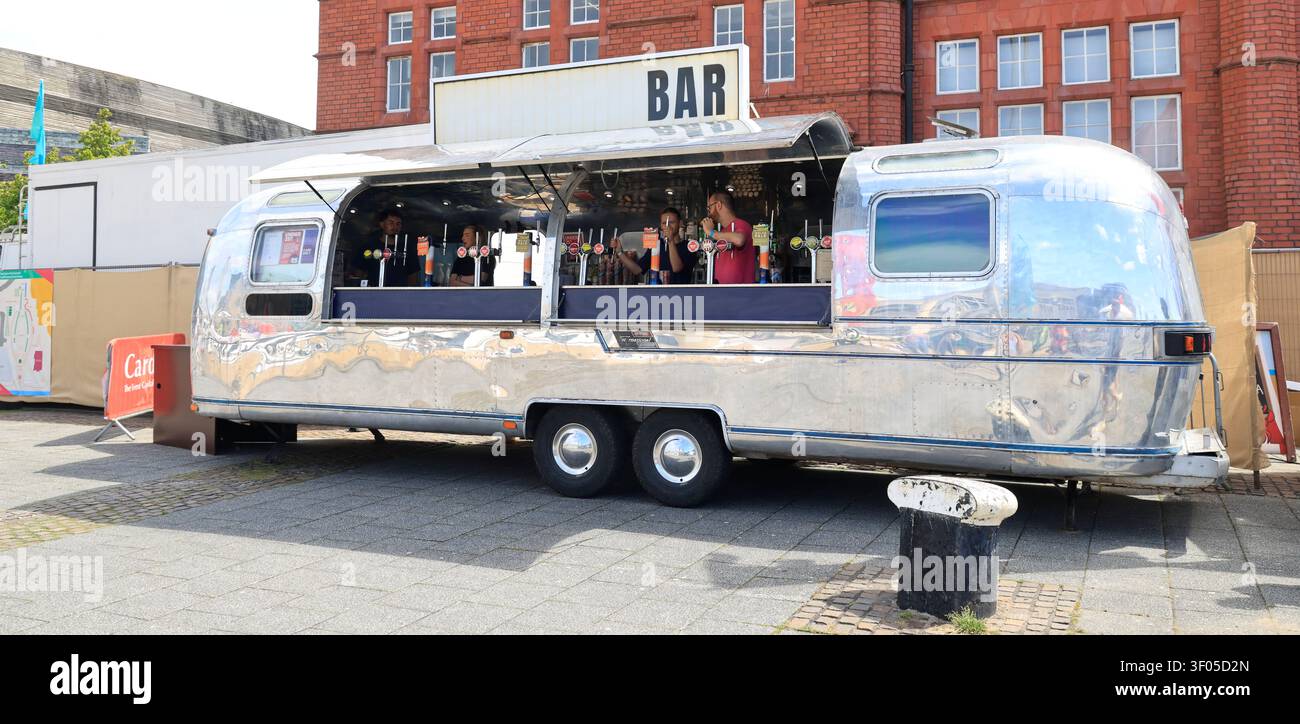 Shiny Airstream event bar at Cardiff Bay Food Festival, Cardiff Bay, South Wales, UK. Taken July 2026 summer Stock Photo
