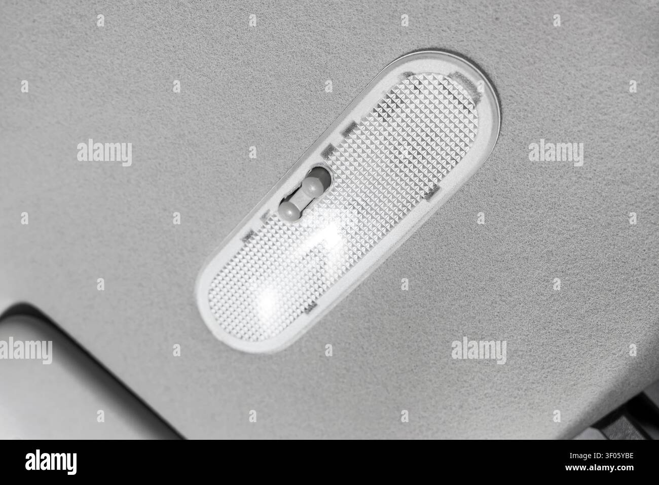 Close-up of car interior dome light switch Stock Photo