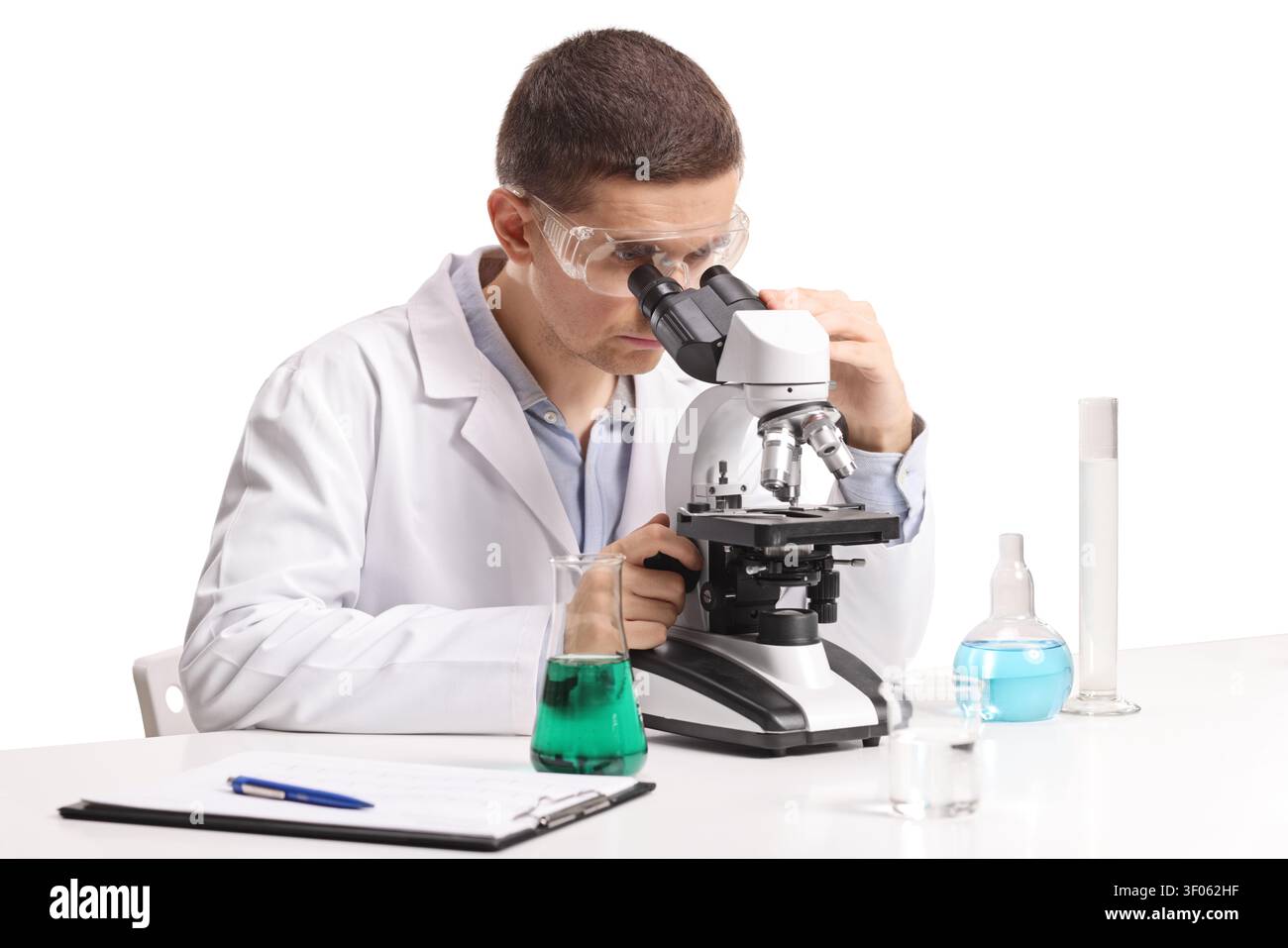 Laboratory scientist looking through microscope isolated on white background Stock Photo
