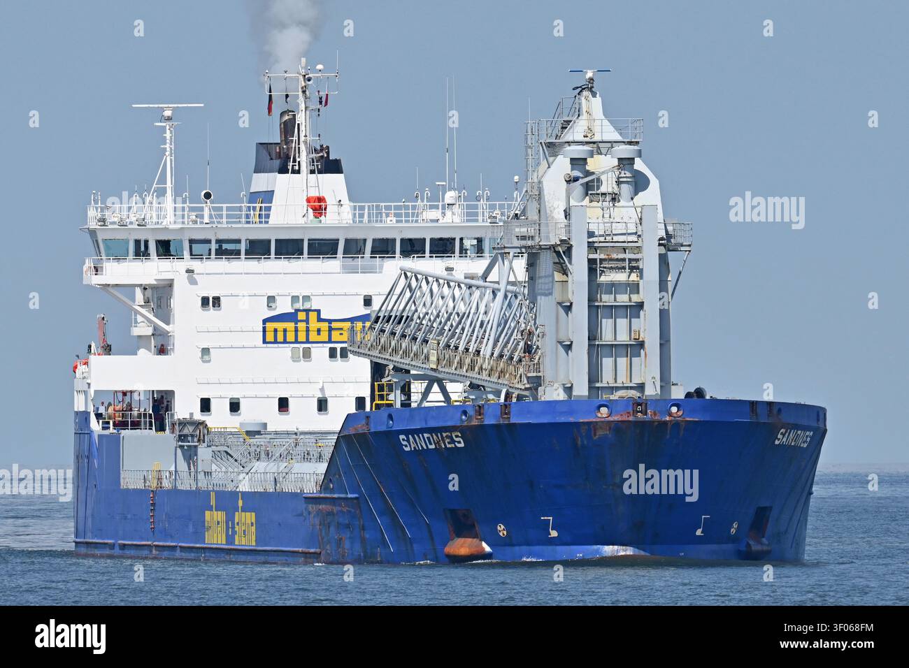 Self-discharging bulk-carrier SANDNES passing Cuxhaven Stock Photo