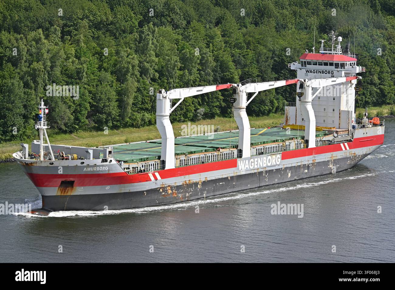 General cargo ship AMURBORG passing the Kiel canal Stock Photo