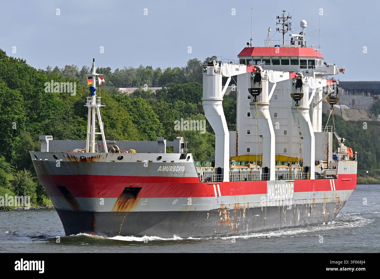 General cargo ship AMURBORG passing the Kiel canal Stock Photo