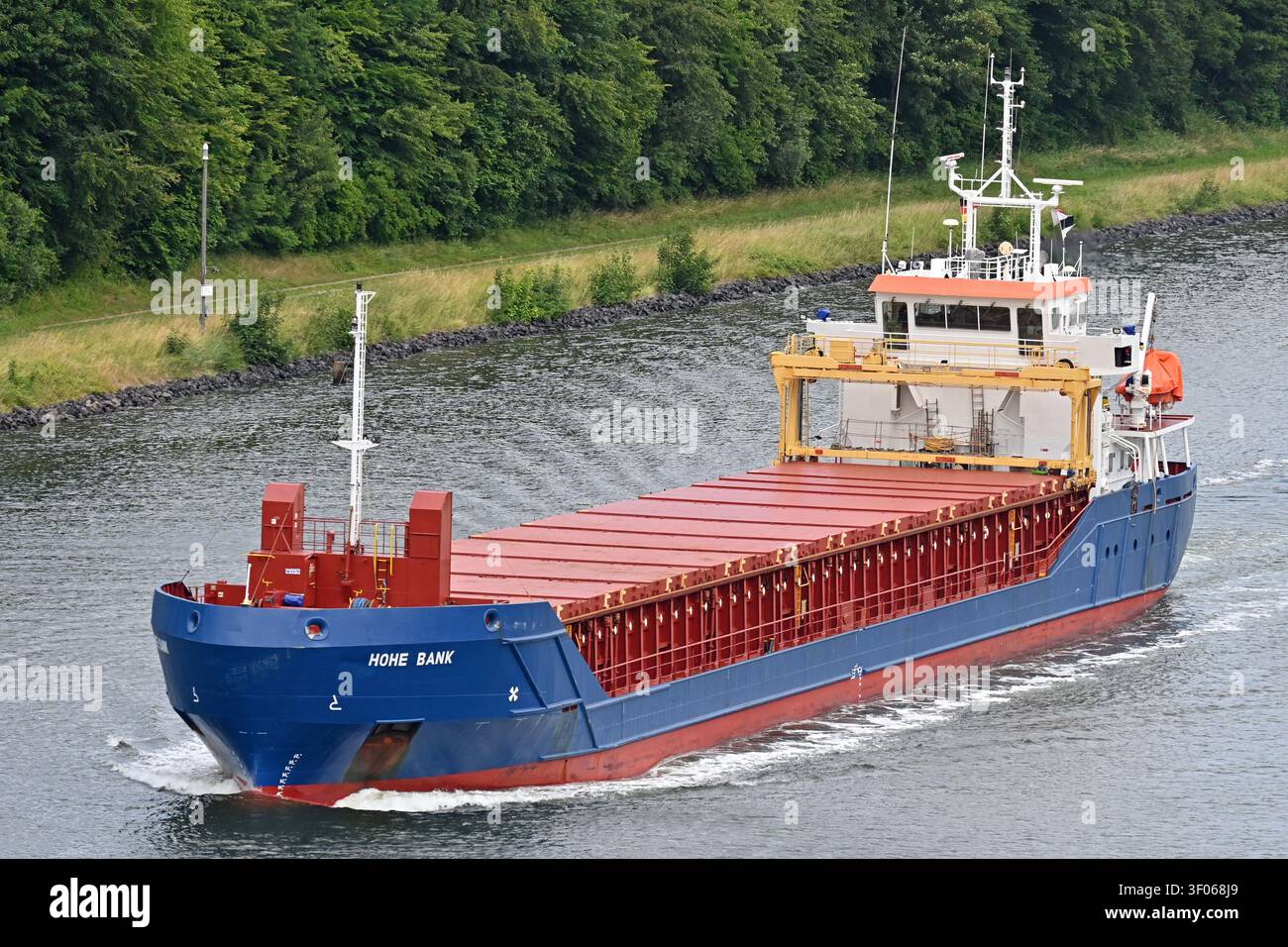 General cargo ship HOHE BANK passing the Kiel canal Stock Photo