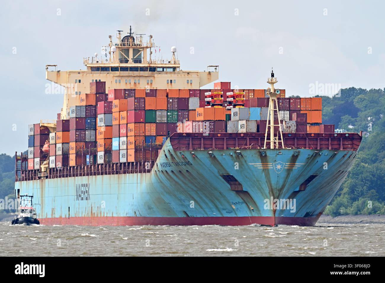 Containership MAERSK TANJONG arrives at the port of Hamburg Stock Photo