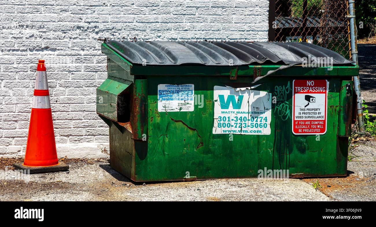 A commercial dumpster by Waste management Stock Photo