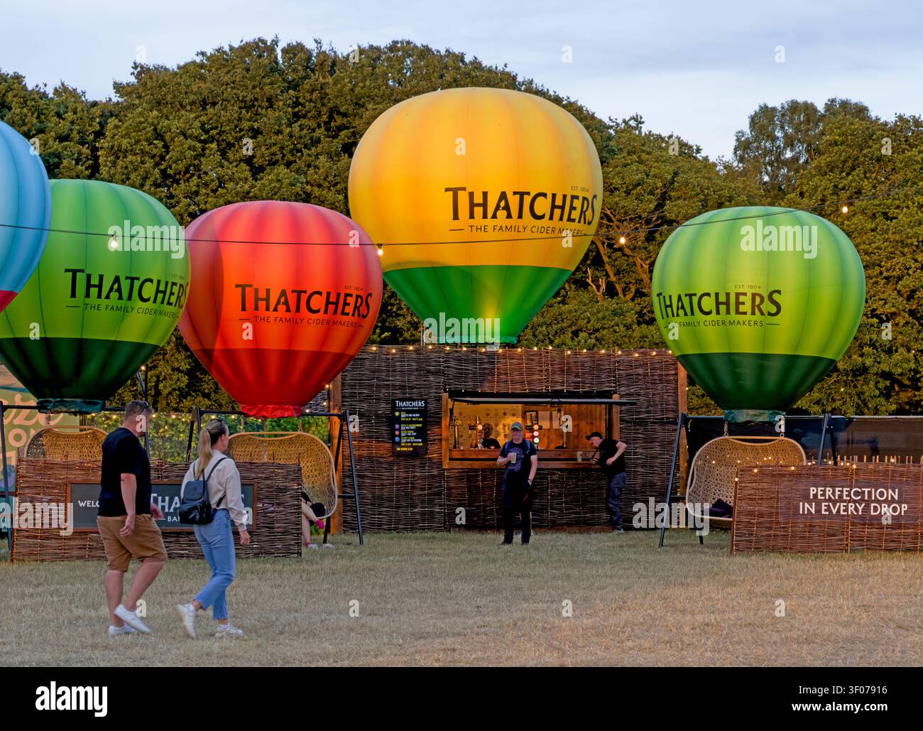 Colourful Thatchers cider bar and balloon displays at Silverstone Woodlands Campsite during the 2026 British Grand Prix weekend Stock Photo