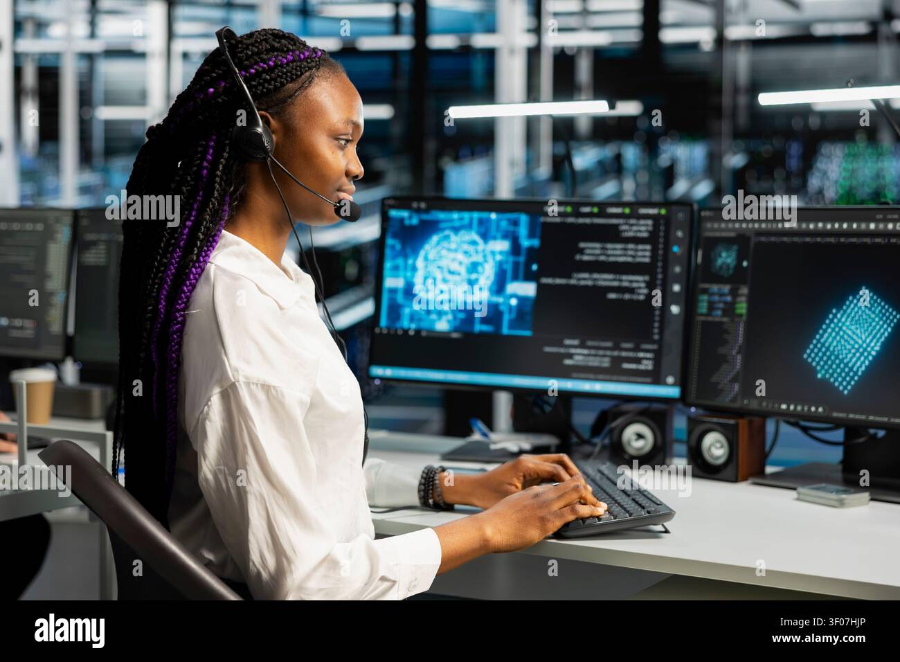 Administrator wears a headset in a server hub, using artificial intelligence troubleshooting to assist users. Stock Photo