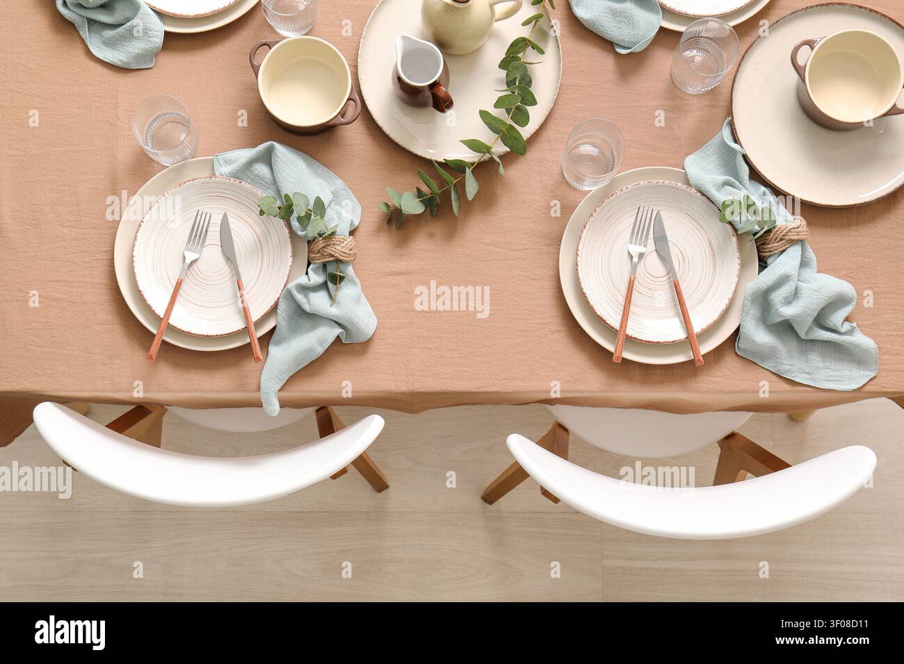 Minimalist dining table set for two with natural decor Stock Photo