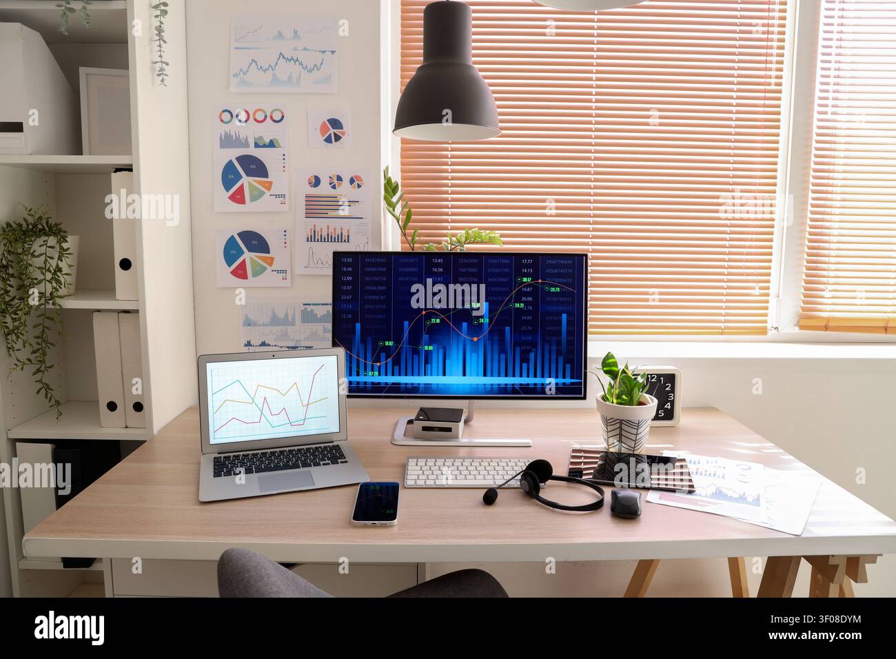 Data scientists workplace with computer and diagrams in office Stock Photo