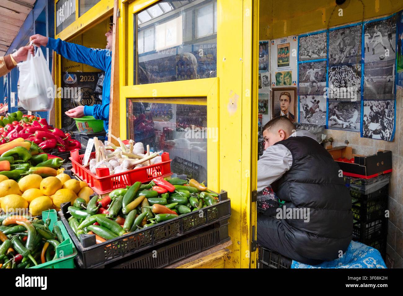 A greengrocer who is a huge fan of PFC Levski Sofia football team, Zhenski Pazar Women's Market, Sofia, Bulgaria, The Balkans, Eastern Europe Stock Photo