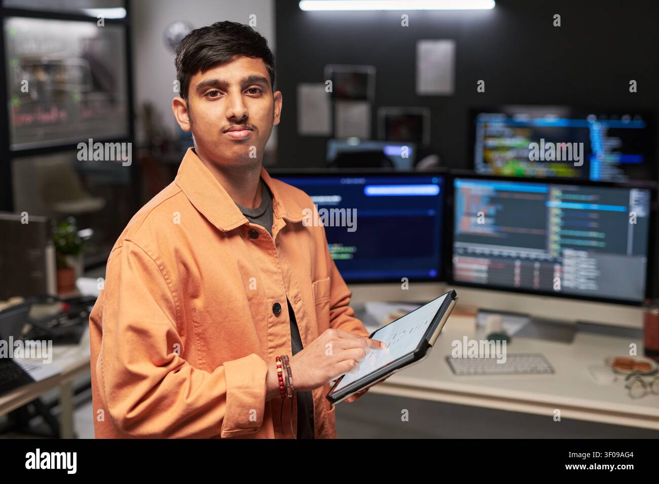Portrait of Web Engineer Using Tablet in Software Development Stock Photo
