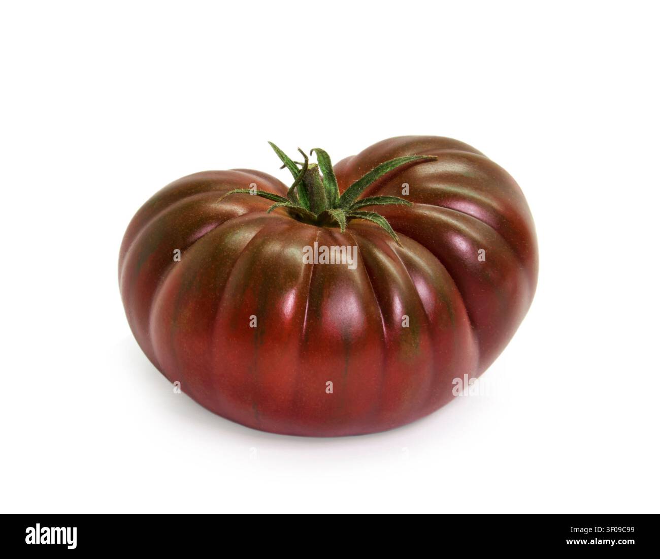 Heirloom tomato red brown vegetable on white background Stock Photo